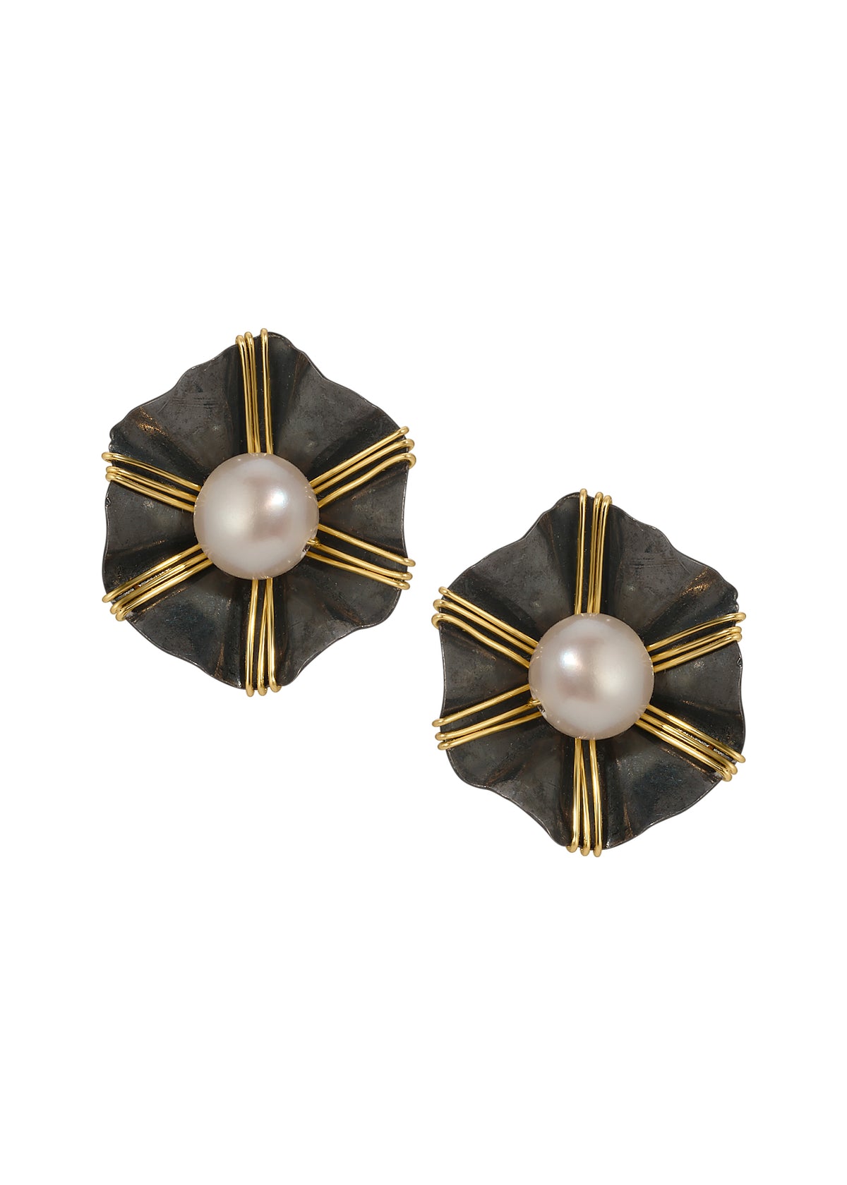 Freshwater pearl stud earrings with 14k gold fill accents on blackened sterling silver flower-shaped bases.
