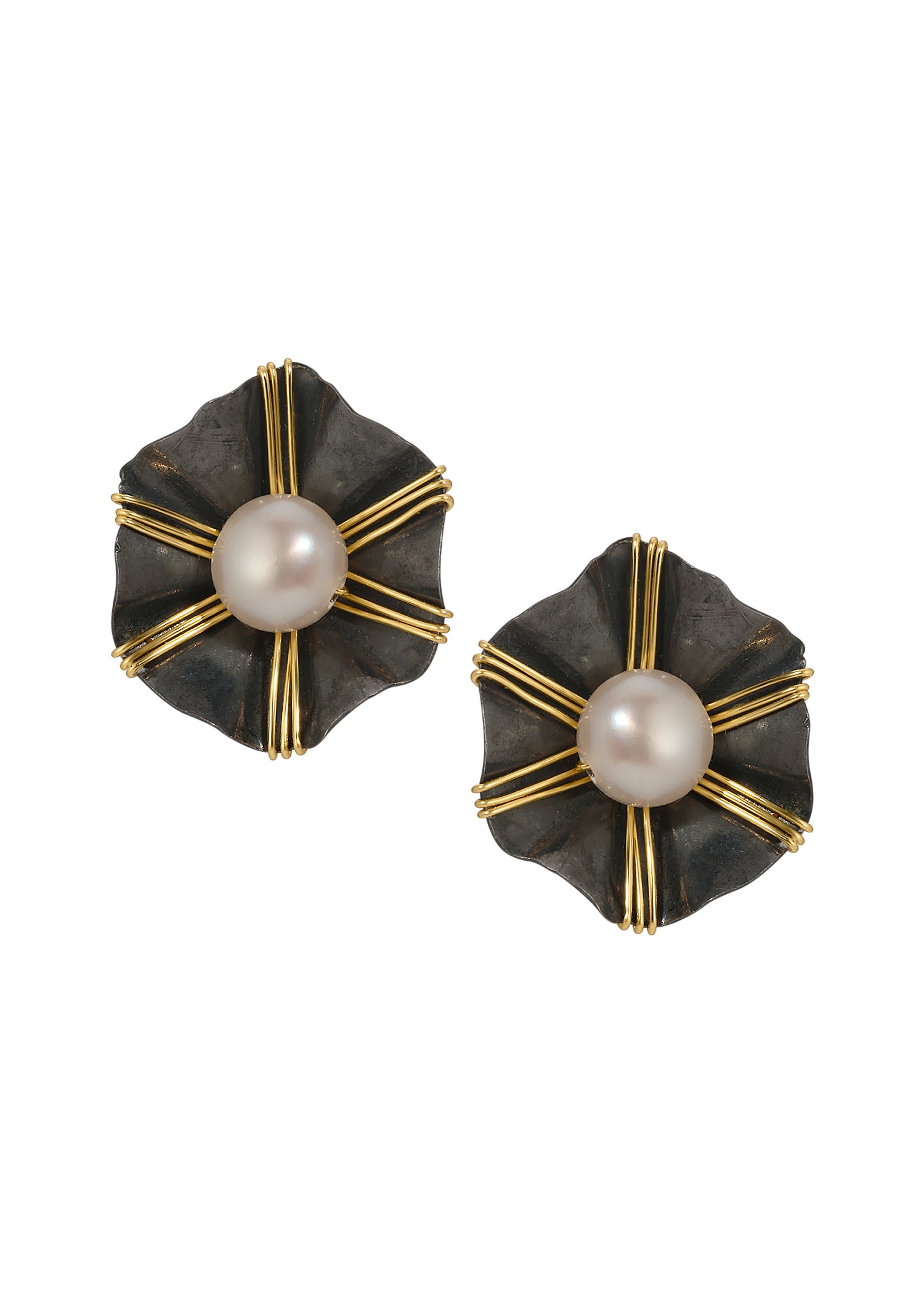 Freshwater pearl stud earrings with 14k gold fill accents on blackened sterling silver flower-shaped bases.