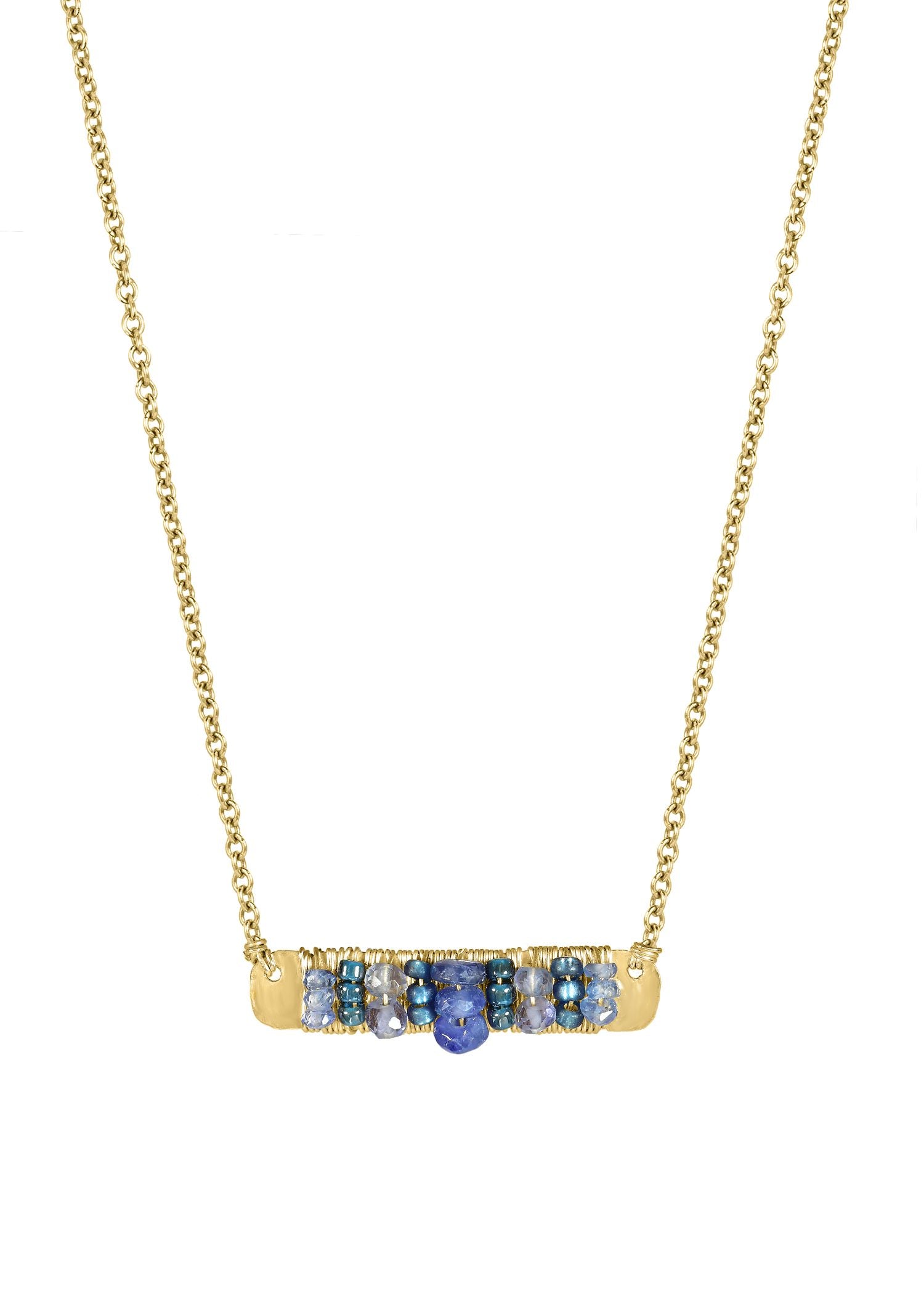 Blue bar necklace with sapphire, kyanite, and tanzanite seed beads on a 14k gold fill chain with hand wire-wrapped detail.