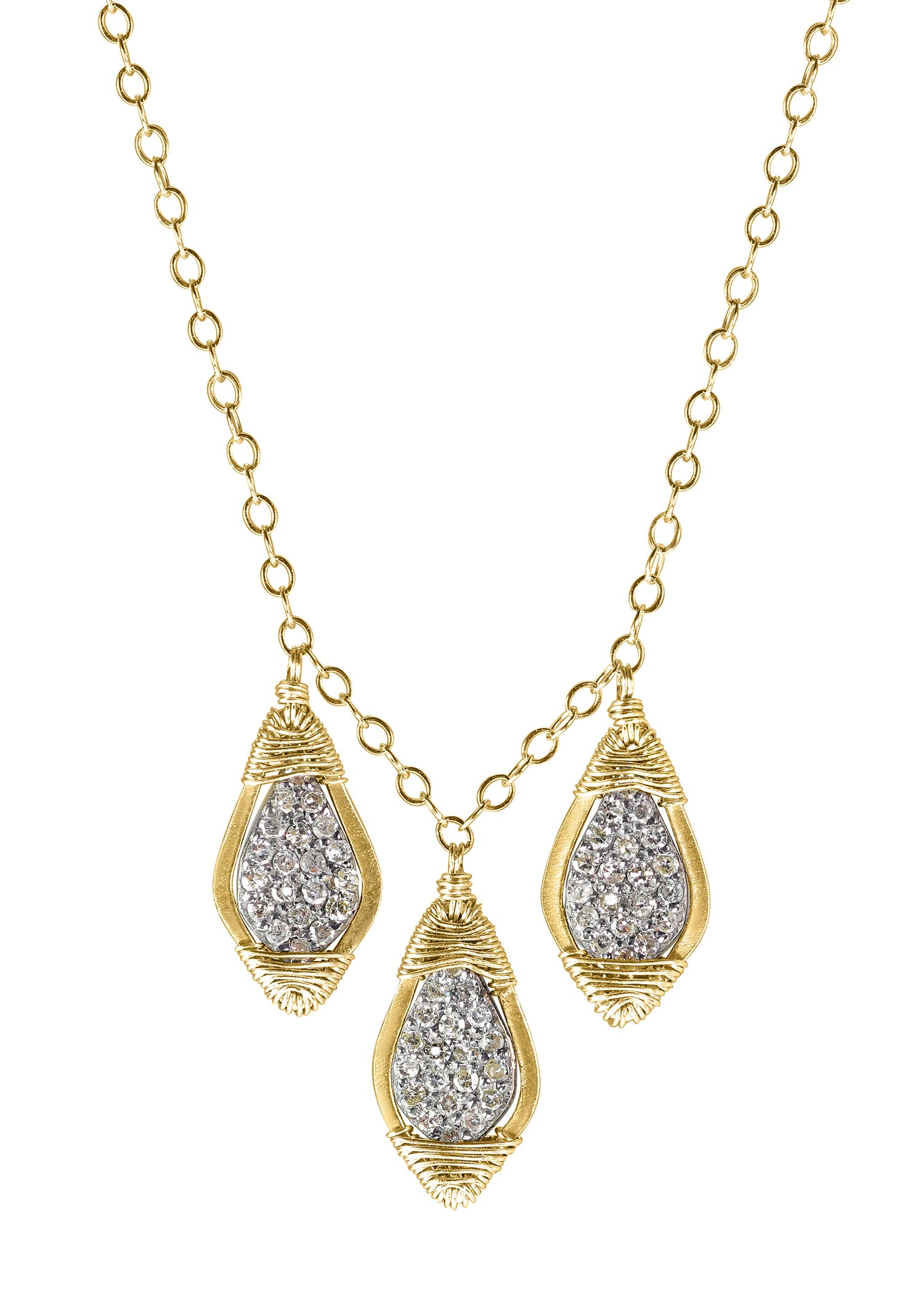 Diamond triple leaf necklace featuring hand wire-wrapped 14k gold and sterling silver pendants on a gold chain.