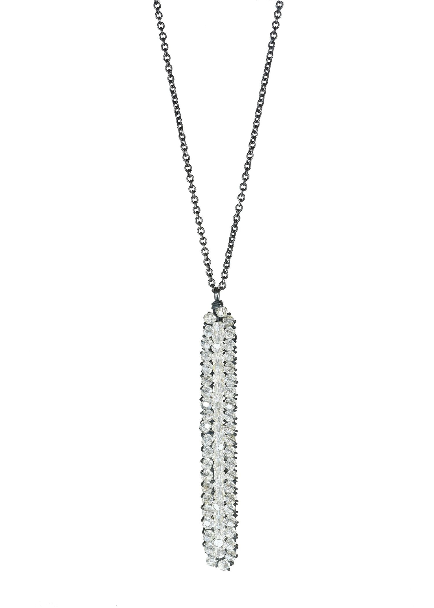 Crystal icicle necklace in blackened sterling silver with a long, slender, hand wire-wrapped pendant design.