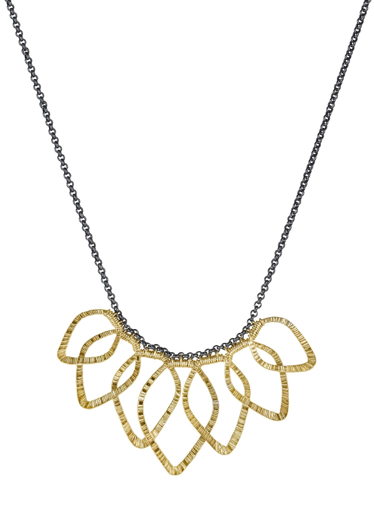Leaf bib necklace featuring overlapping textured 14k gold fill leaves on an oxidized sterling silver chain.