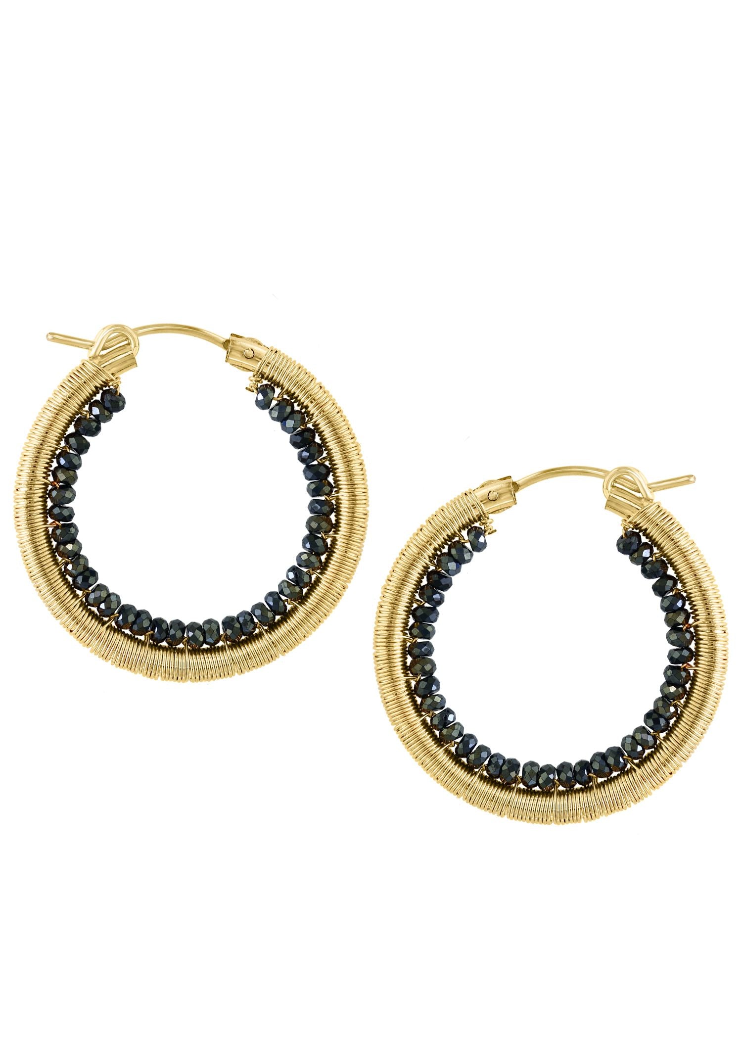Black spinel hoop earrings in 14k gold fill, hand wire-wrapped with faceted black beads in a circular shape.
