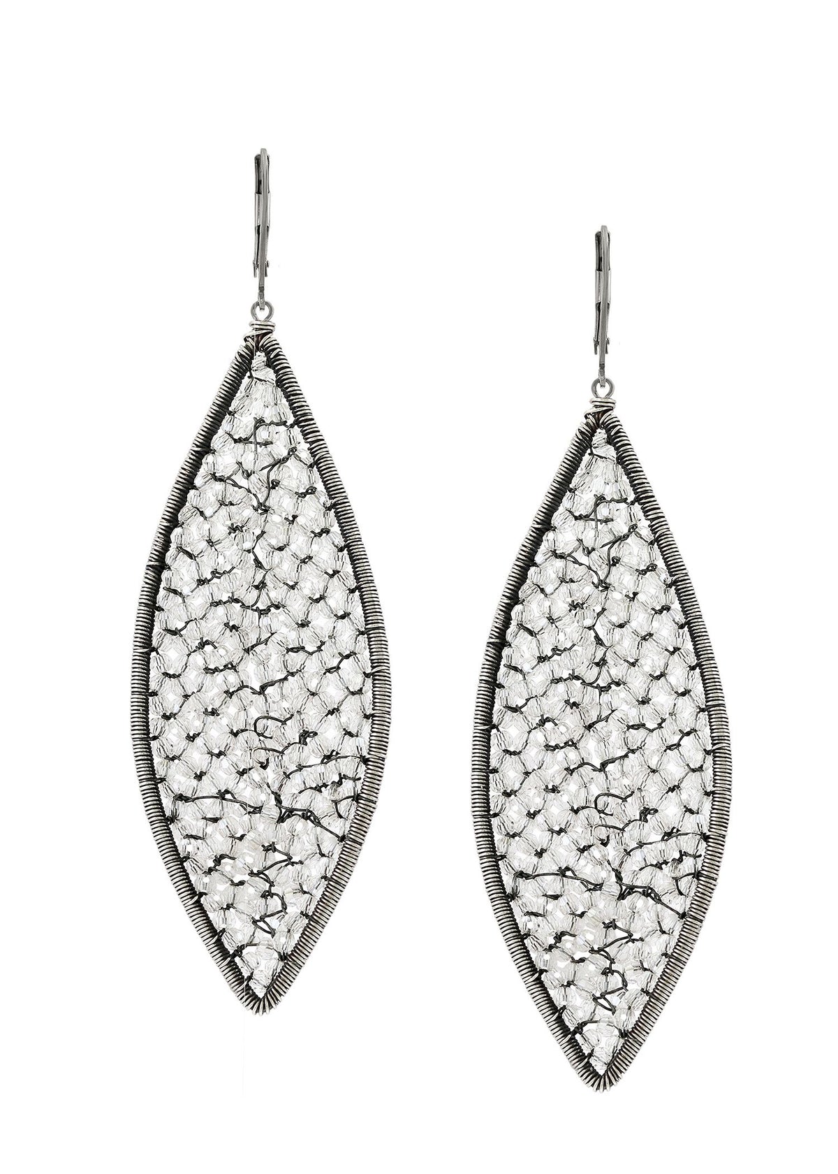 Crystal earrings in sterling silver, featuring hand wire-wrapped flame-shaped designs with clear crystals.