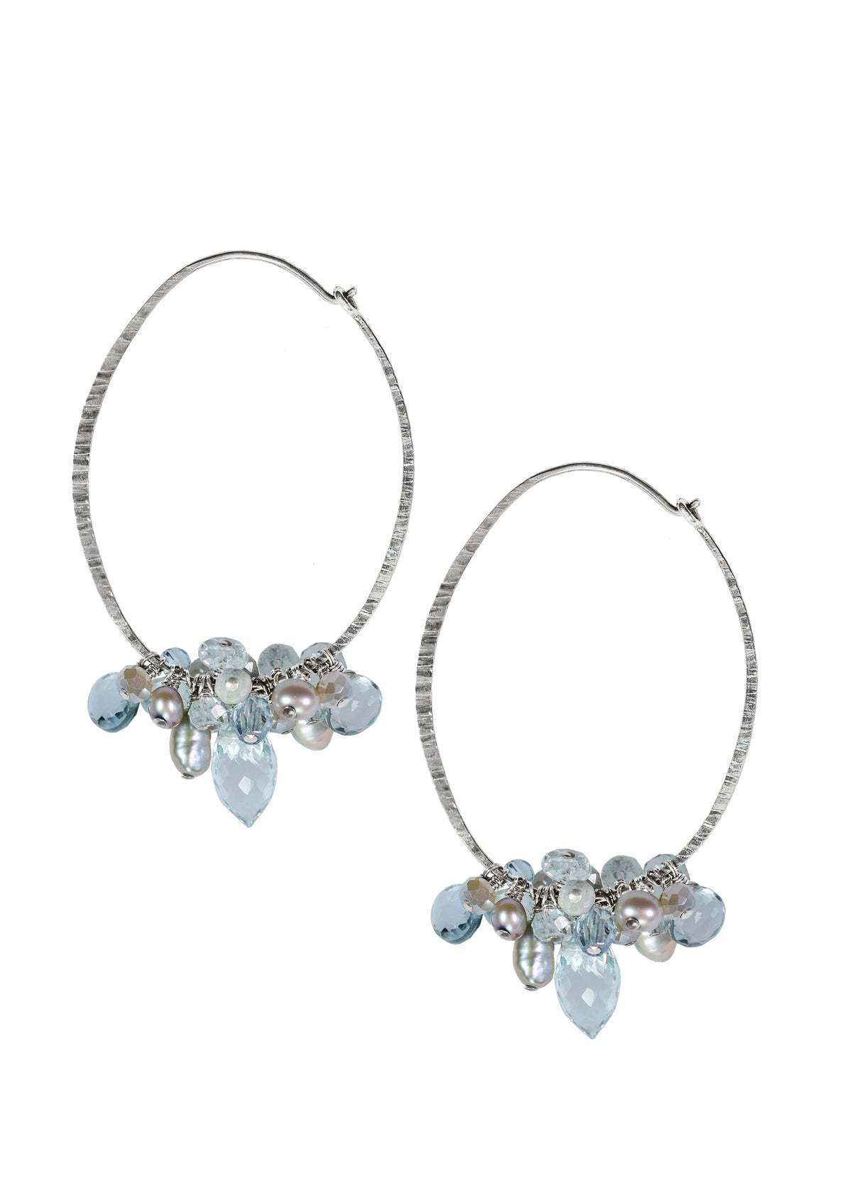 Hoops with aqua quartz, corundum, and freshwater pearls on hand-textured sterling silver, 2 inches long.