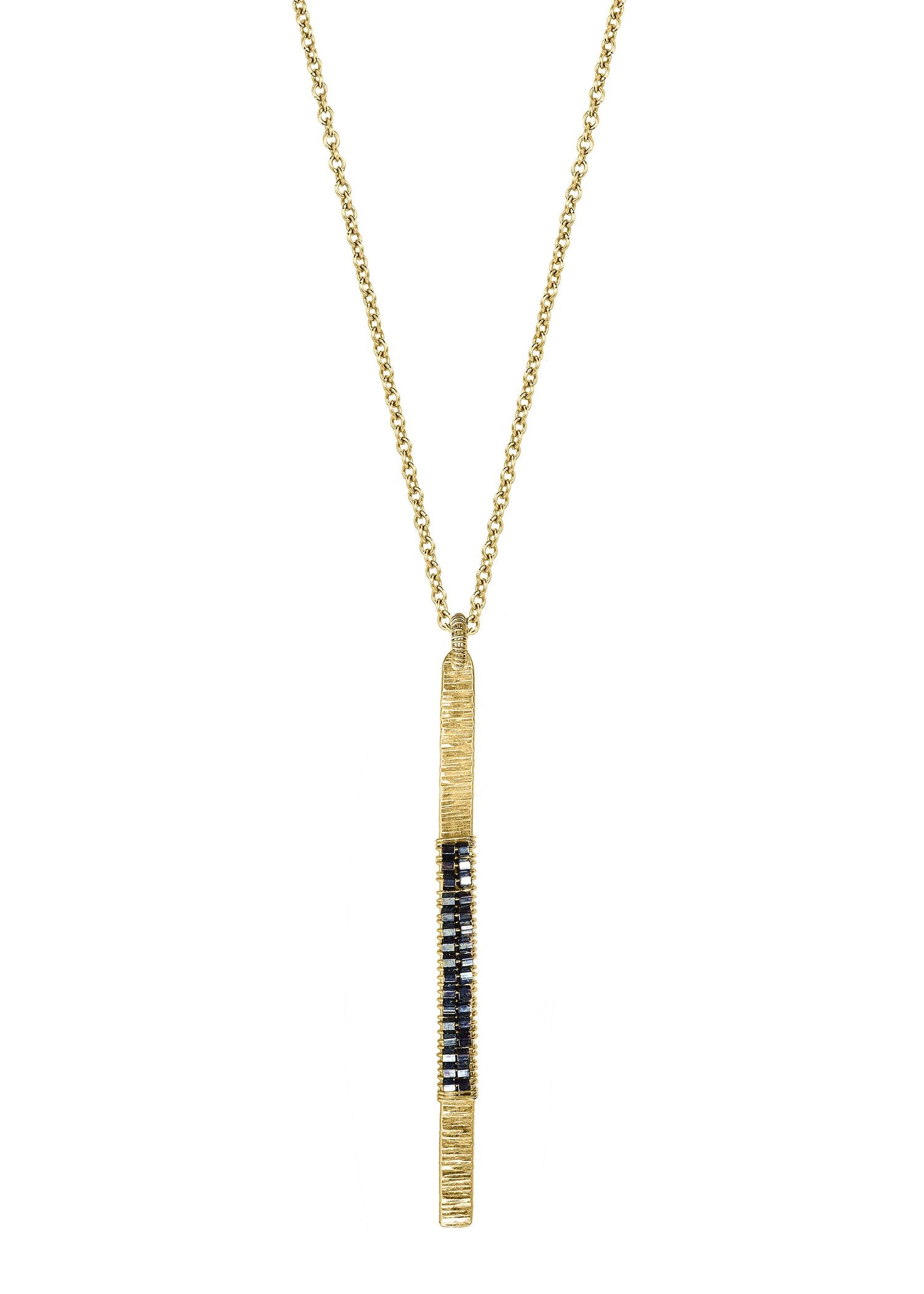 Hematite bead necklace in 14k gold fill featuring a long, hand-textured bar pendant on a delicate chain.