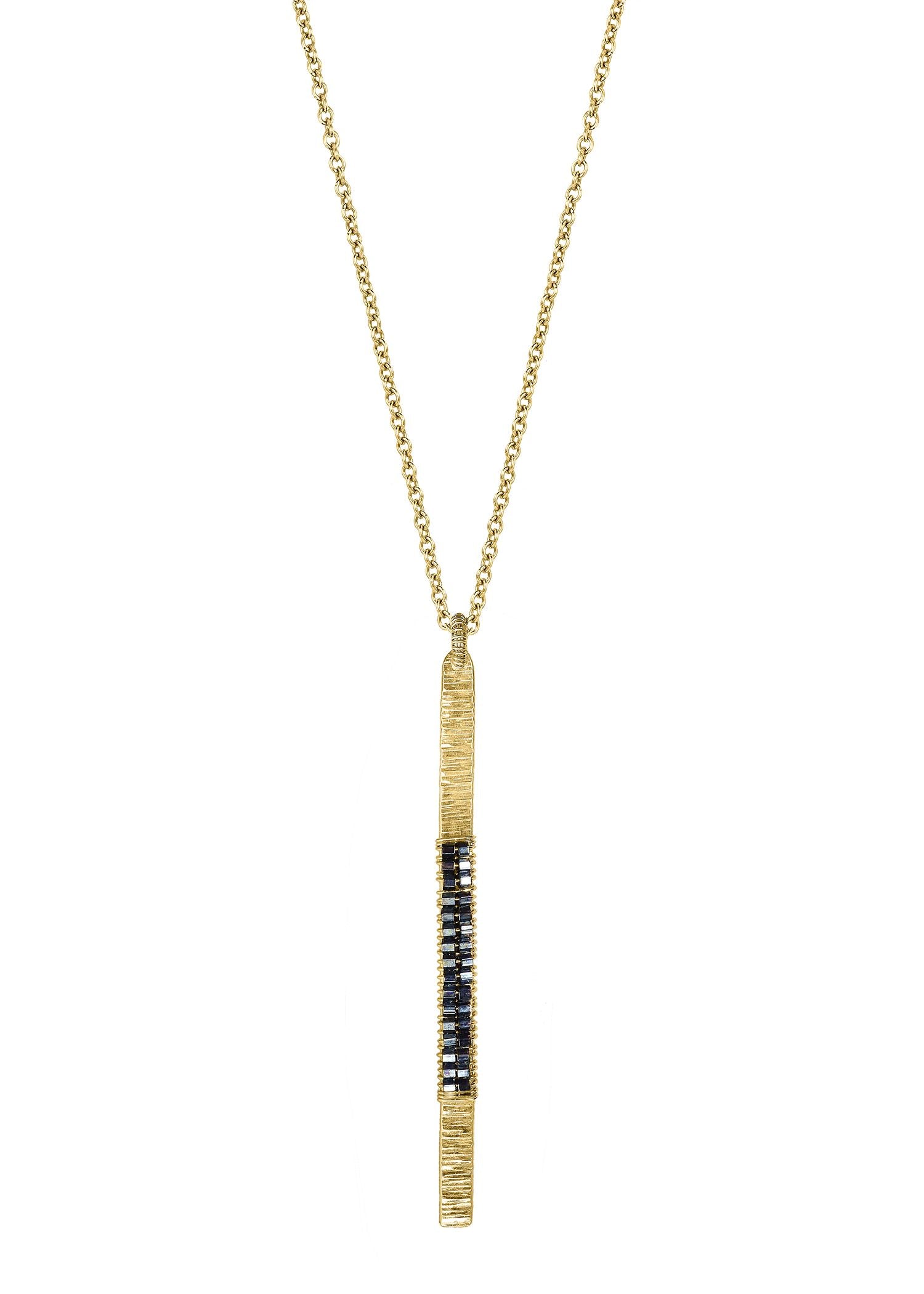 Dark hematite seed beads 14k gold fill Necklace measures 16-1/2" in length Pendant measures 2 in length and 1/8" in width Handmade in our Los Angeles studio
